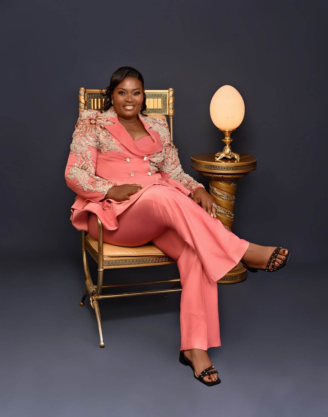 Sade Balogun seated